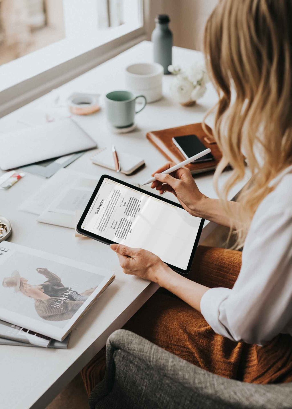 Woman using The Astrology of You journal